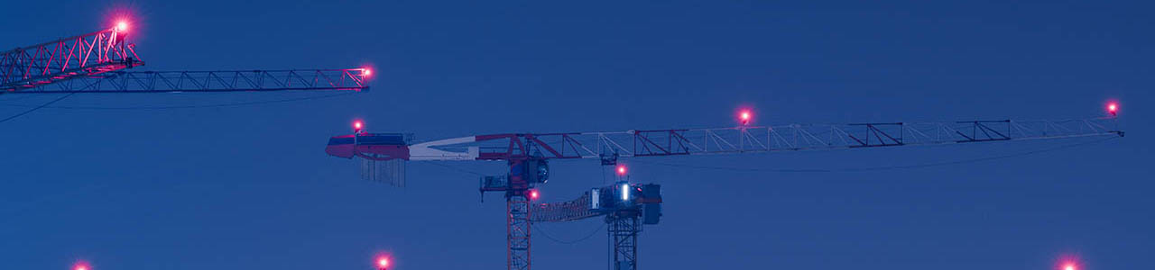 Cranes at night with obstruction lights