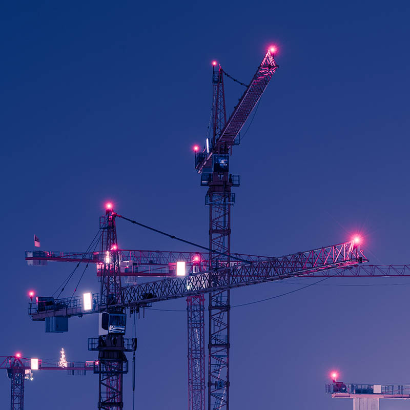 Cranes with obtruction lights at night